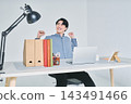 A man working at a desk 143491466