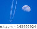 An airplane flying close to the moon An airplane flying close to the moon 143492924