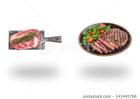 Raw ribeye on a wooden board beside grilled beef with salad on a platter floating above shadows on white 143495766