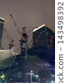 Night view of the area around Tokyo Station, construction site cranes 143498392