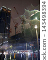 Night view of the area around Tokyo Station, construction site cranes 143498394