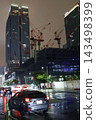 Night view of the area around Tokyo Station, construction site cranes 143498399
