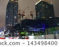 Night view of the area around Tokyo Station, construction site cranes 143498400