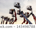 Articulate boom lift with blue sky background, Aerial platform lift telescopic boom lift hydraulic boom lift, Mobile construction crane, Construction boom lifts 143498788
