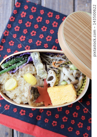 Autumn Japanese food bento box with sticky rice, served in a bentwood box. Autumn Japanese food bento box with sticky rice, served in a bentwood box. 143500622