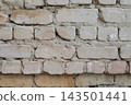 Old weathered white brick wall texture with rough cement mortar and aged neutral masonry surface. Vintage industrial background for architectural design, urban grunge patterns and historical 143501441