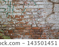 Old weathered brick wall texture with green graffiti paint, peeled white layers and exposed red clay. Vintage industrial background surface for urban design, grunge architecture, abstract patterns. 143501451