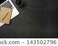 Top view of dark stone desk background with laptop, notebook and office supplies with large copy space 143502796