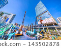 Tokyo cityscape, October 9th. New construction project for facilities above the west exit of Shibuya Station. A row of heavy machinery… 143502878