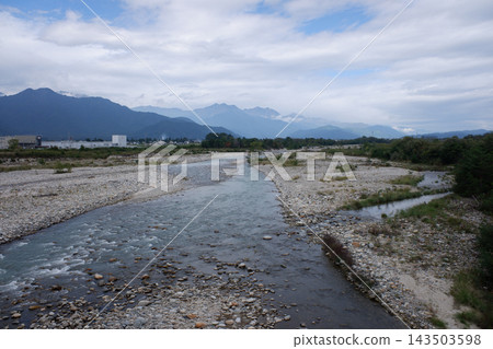 View to the north from Miyamoto Bridge on the Takase River in Omachi City, Nagano Prefecture. View to the north from Miyamoto Bridge on the Takase River in Omachi City, Nagano Prefecture. 143503598