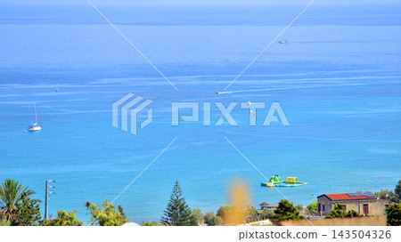 Cefalu, Italy. 22 August 2026. A panoramic view of the town, situated right by the sea and its urban development amidst the greenery Cefalu, Italy. 22 August 2026. A panoramic view of the town, situated right by the sea and its urban development amidst the greenery 143504326