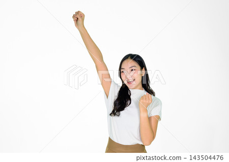 Excited Asian Girl Celebrating Victory with Raised Fist on White Background Excited Asian Girl Celebrating Victory with Raised Fist on White Background 143504476