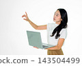 Asian Girl Holding Laptop and Pointing on White Background 143504499