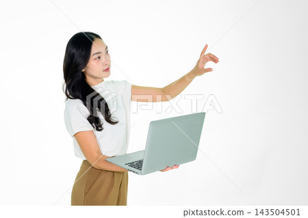 Asian Girl Holding Laptop and Pointing on White Background 143504501