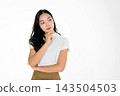 Thoughtful Young Asian Girl Posing Against White Background with Hand on Chin in Casual Outfit 143504503