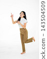 Happy Asian Girl Pointing Up and Posing Playfully on White Background Full Body Studio Shot 143504509