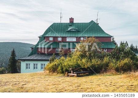 Masaryk's cottage on Serlich stands in the Orlicke Mountains. It is a well-known spot, surrounded by trees and grassy fields. Visitors often enjoy activities nearby in nature. Masaryk's cottage on Serlich stands in the Orlicke Mountains. It is a well-known spot, surrounded by trees and grassy fields. Visitors often enjoy activities nearby in nature. 143505189