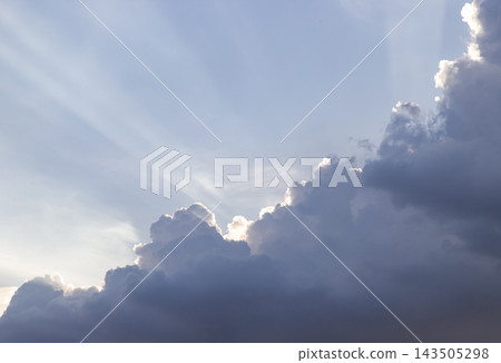 Dramatic Crepuscular Sun Rays Beaming Behind Dark Cumulus Clouds. Dramatic Crepuscular Sun Rays Beaming Behind Dark Cumulus Clouds. 143505298