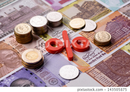 The percentage sign on cash as a concept for inflation or tax liabilities. The percentage sign The percentage sign on cash as a concept for inflation or tax liabilities. The percentage sign 143505875