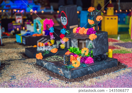 Flower garland and RIP cross on a handmade Mexican Day of the Dead miniature tomb Flower garland and RIP cross on a handmade Mexican Day of the Dead miniature tomb 143506877