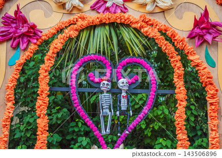 Decorative skeleton couple inside a heart shaped floral arch. Decorative skeleton couple inside a heart shaped floral arch. 143506896
