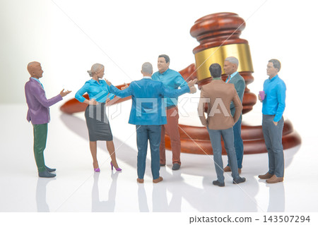 Miniature people engage in discussion near a large gavel figure, reflecting a courtroom scene Miniature people engage in discussion near a large gavel figure, reflecting a courtroom scene 143507294