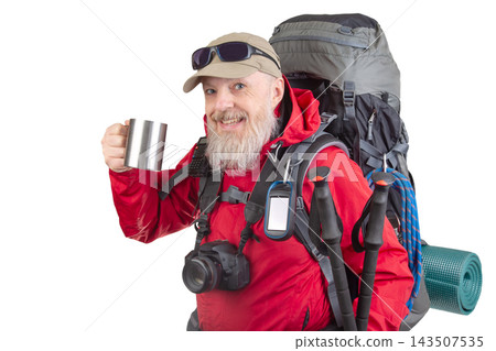 Hiker holding a mug while preparing for a trek with a large backpack and camera Hiker holding a mug while preparing for a trek with a large backpack and camera 143507535