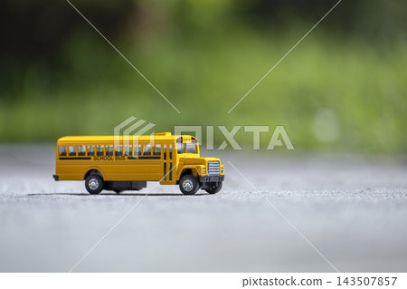 Little model of american yellow school bus outdoor. Concept of education safety in the USA Little model of american yellow school bus outdoor. Concept of education safety in the USA 143507857