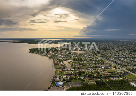 Hurricane season in Florida. Rainstorm sweeping across Charlotte Harbor. Heavy precipitation and moving storm clouds in humid subtropical climate. Hurricane season in Florida. Rainstorm sweeping across Charlotte Harbor. Heavy precipitation and moving storm clouds in humid subtropical climate. 143507895