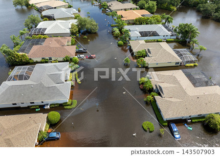 Hurricane flooded cars and homes in residential community in Florida, USA. Aftermath of natural disaster 143507903