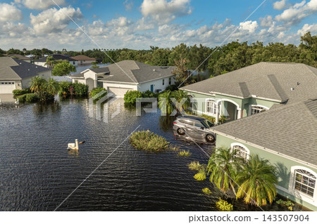 Hurricane Debby tropical rainstorm flooded residential homes and cars in suburban community in Sarasota, Florida. Aftermath of natural disaster Hurricane Debby tropical rainstorm flooded residential homes and cars in suburban community in Sarasota, Florida. Aftermath of natural disaster 143507904