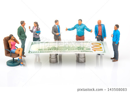 Miniature people discussing around a large dollar bill in a meeting setup Miniature people discussing around a large dollar bill in a meeting setup 143508083