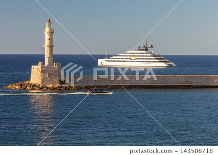Luxury Yacht and Venetian Lighthouse in Chania, Crete, Greece Luxury Yacht and Venetian Lighthouse in Chania, Crete, Greece 143508718