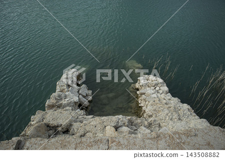 Submerged Stone Ruins Entering Clear Turquoise Water of a Lake Reservoir.Amadorio Reservoir, Alicante, Spain 143508882