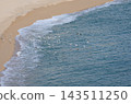 Flock of Seagulls Flying Over Mediterranean Beach and Sea 143511250
