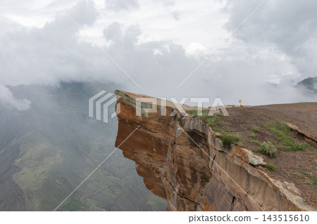 Rocky cliff edge Troll Tongue at scenic mountain gorge in Goor Rocky cliff edge Troll Tongue at scenic mountain gorge in Goor 143515610