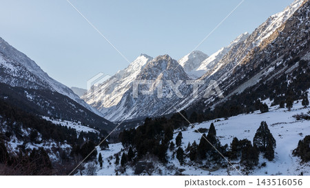 Panoramic view of snow covered peaks in the scenic Alamedin Gorge Panoramic view of snow covered peaks in the scenic Alamedin Gorge 143516056