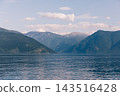 Scenic view of tranquil waters and mountains at Teletskoye Lake 143516428