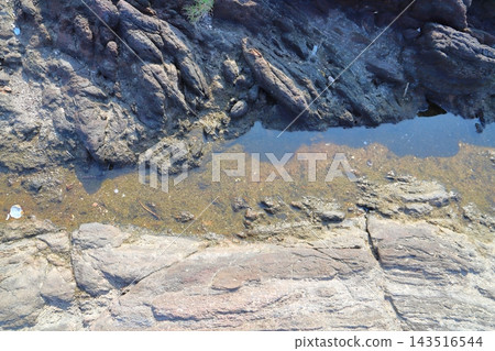 Seawater remaining on the rocks Seawater remaining on the rocks 143516544