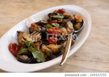 Roasted eggplant caponata in ceramic dish Roasted eggplant caponata in ceramic dish 143517735