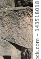 Rough textured ancient stone wall surface close up 143518018