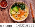 Soup with wontons and bok choy 143519111