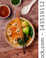 Soup with wontons and bok choy 143519112