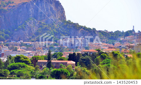 Cefalu, Italy. 22 August 2026. A view of the town situated right beneath the great rock of La Rocca. Cefalu, Italy. 22 August 2026. A view of the town situated right beneath the great rock of La Rocca. 143520453