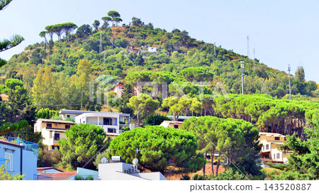 Cefalu, Italy. 22 August 2026. Buildings situated on a hillside in a picturesque corner of Sicily. 143520887