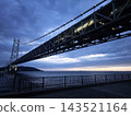 Akashi Kaikyo Bridge Steel Structure Illuminated at Dusk in Kobe, Japan. 143521164