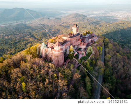 Popular travel destination with hilltop castle. Castle Haut-Koenigsbourg, Alsace, France - April 10, 2026 - Popular travel destination with hilltop castle, panoramic views over vineyards and villages, 143521381