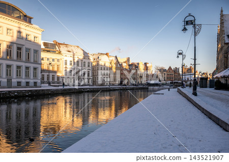 The outdoors in Ghent during the winter. Ghent, Belgium - January, 6, 2026: Ghent's Old Town covered with snow during the winter holidays. 143521907