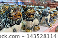 Ceramic Shisa figurines lined up in souvenir shops in Okinawa Prefecture 143528114