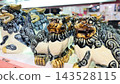 Ceramic Shisa figurines lined up in souvenir shops in Okinawa Prefecture 143528115